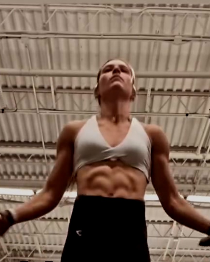 Mari Grossi mid jump-rope set in her gym